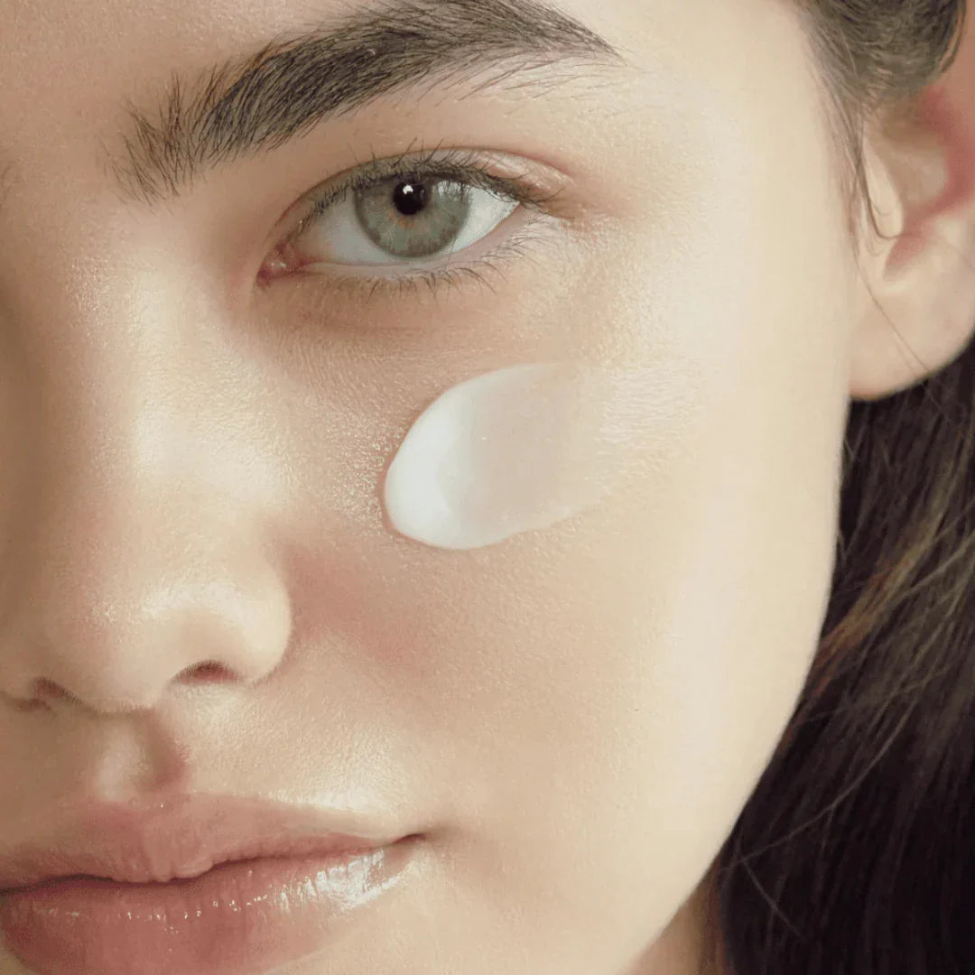 AXIS Y TXA 2.5% Intensive Brightening Cream in a 50ml jar, featuring a smooth, white cream texture for skin brightening.