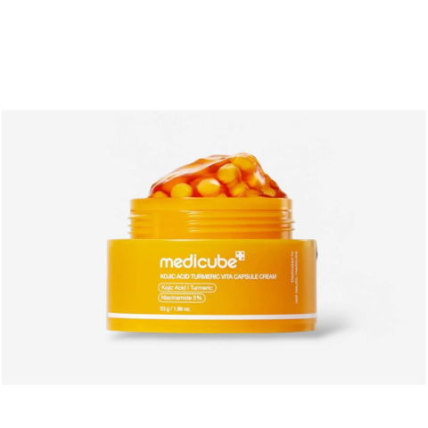 Medicube Kojic Acid Turmeric Vita Capsule Cream jar showing the product label and cream texture, designed for skin brightening glam secret